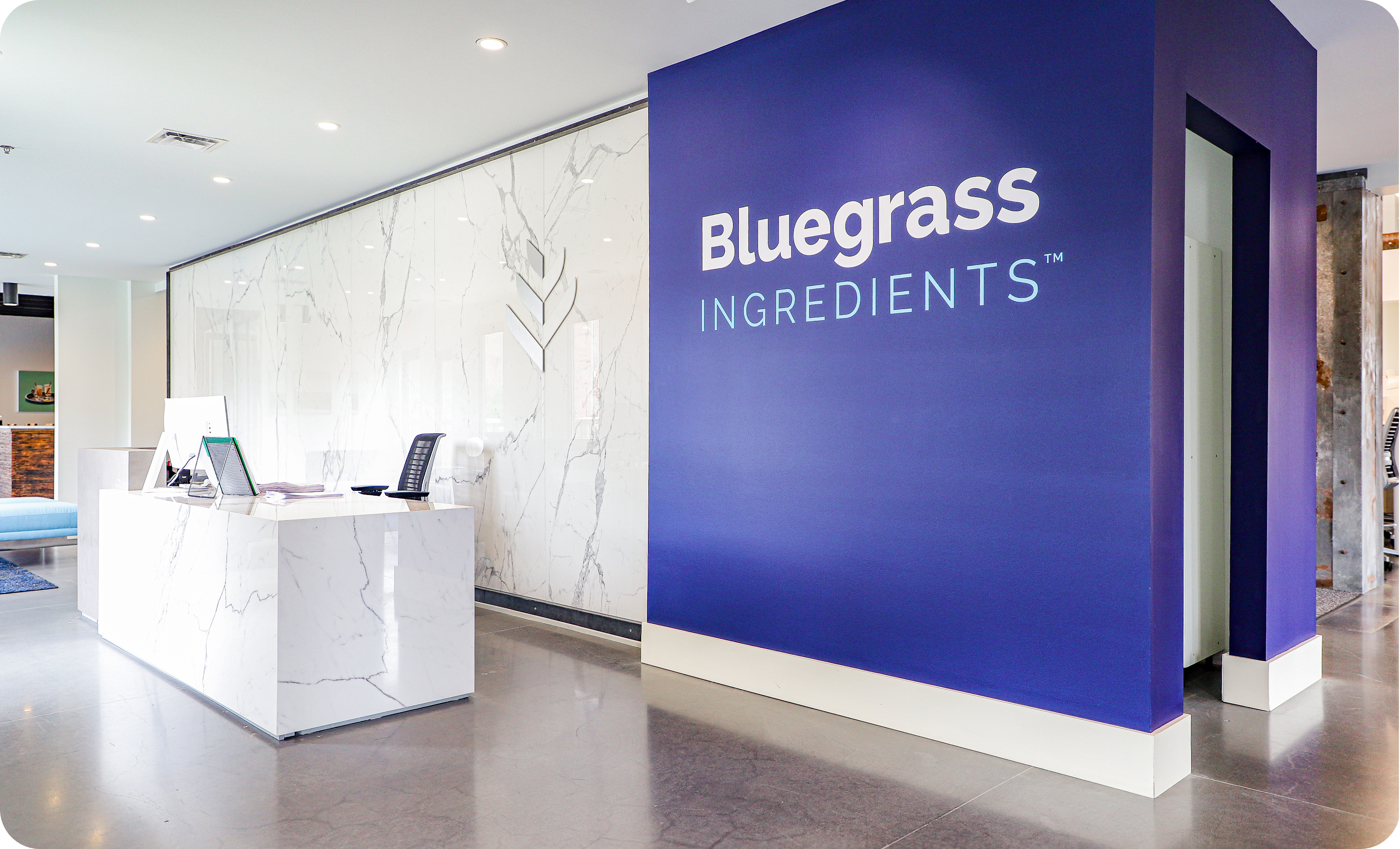 Every detail at Bluegrass Ingredients, from the custom blue furniture to the open collaboration zones, reflects their brand.